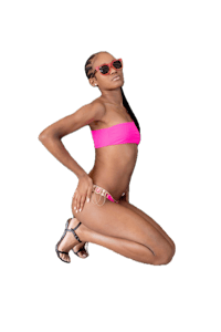 a woman in a pink bikini crouching down