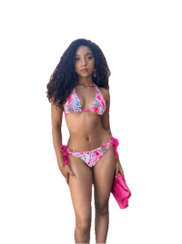 a woman in a pink bikini posing for a photo